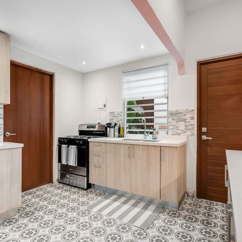 Contemporary kitchen with a cozy charm, perfect for preparing and sharing meals.