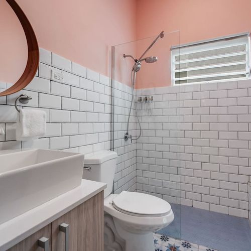 Bright and spotless bathroom with a spacious shower.