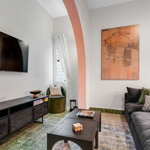 Cozy living area with a large-screen TV, perfect for movie nights and relaxing evenings