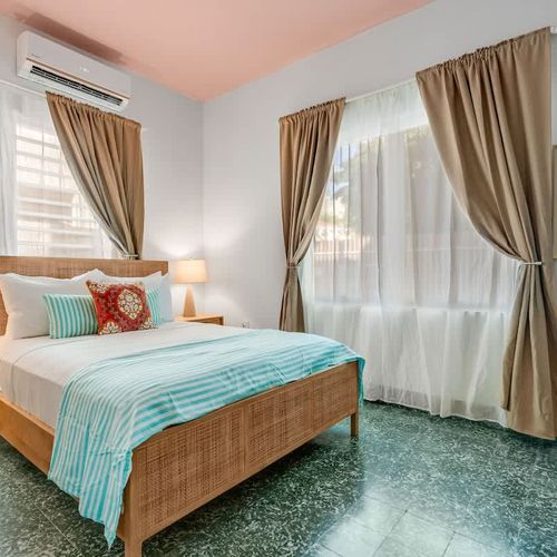 Bright and airy space featuring crisp linens and soft lighting for a restful night.