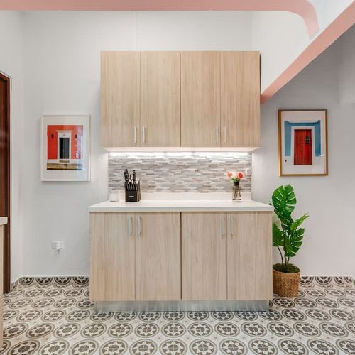 Bright and spacious kitchen featuring sleek countertops and ample storage space.