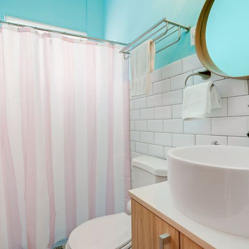 Enjoy a refreshing shower in this minimalist bathroom with clean lines and elegant finishes.