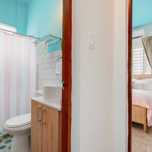 Step from the bedroom into the bathroom with ease, creating a fluid, restful space.