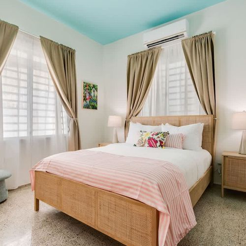 Relax in style with a serene, uncluttered bedroom that invites deep rest.