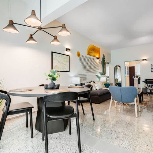 A spacious living and dining area, designed for both relaxation and gathering in style.