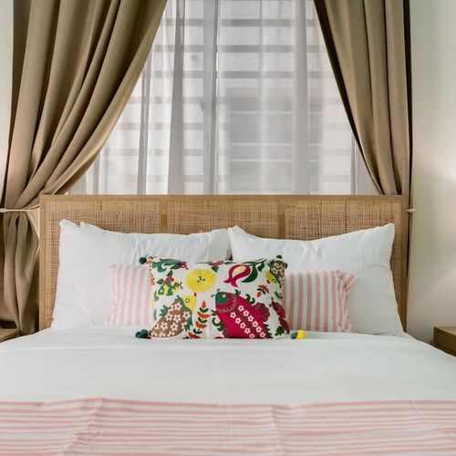 A tranquil bedroom with modern, minimalist decor for your restful getaway.