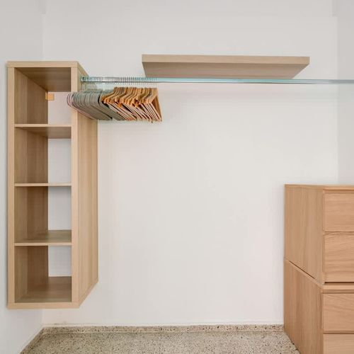 An open, minimalist closet offering ample storage for all your essentials.