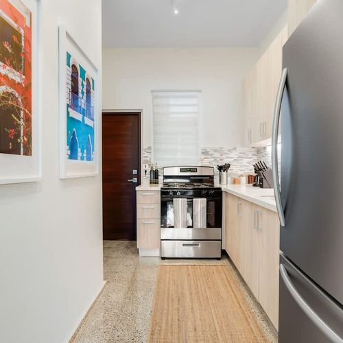 Enjoy a culinary adventure in this spacious, well-equipped kitchen with a contemporary touch.