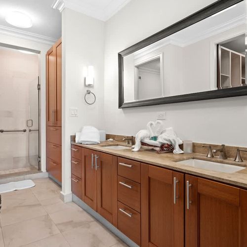 Luxurious dual vanity bathroom. Enjoy the spaciousness of this elegant bathroom featuring double sinks, ample counter space, and a separate shower.
