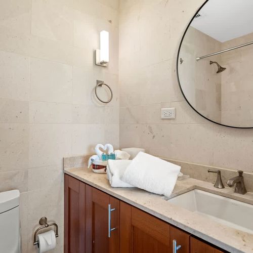 Clean and spacious bathroom with modern fixtures and plenty of counter space.