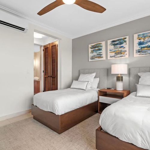 Bright and airy guest room with twin beds. Perfect for sharing or enjoying extra space.