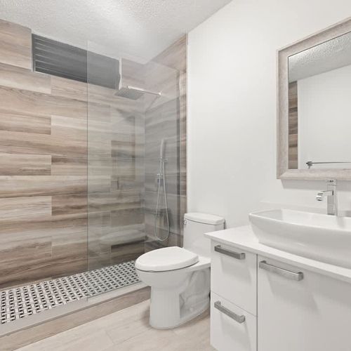 Stylish shower with chic wood-look tiles and modern fixtures