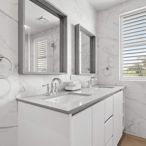 Modern design with beautiful wood-look shower tiles.