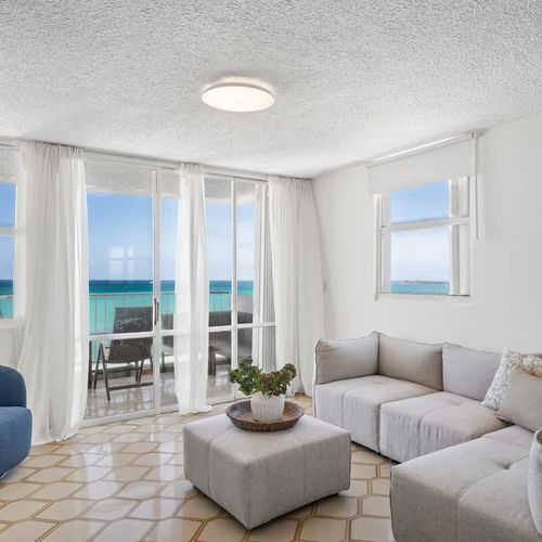 Your ultimate gathering spot! With abundant natural light and stunning ocean vistas, this living room is perfect for entertaining or simply unwinding with loved ones.