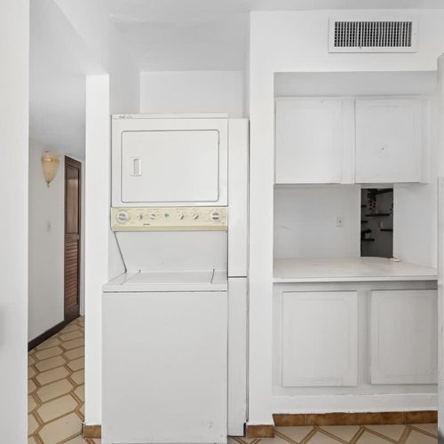 Experience the ease of a fully functional kitchen in your home away from home. With clean lines and essential appliances, it's perfect for preparing your favorite dishes.