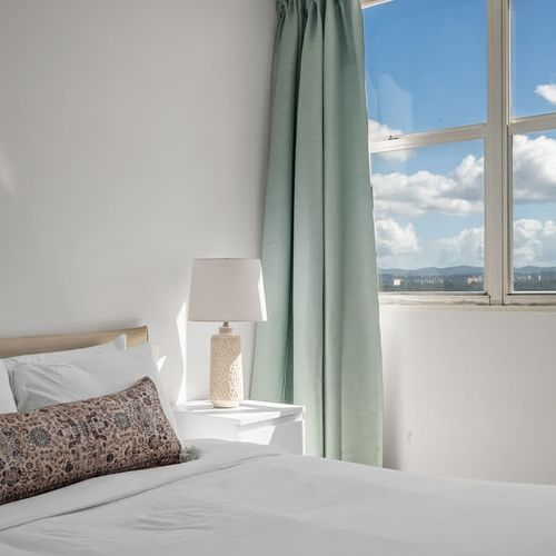 Unwind in style! This cozy bedroom provides a comfortable haven after a day of exploring, with picturesque views and a tranquil ambiance to ensure a restful night's sleep