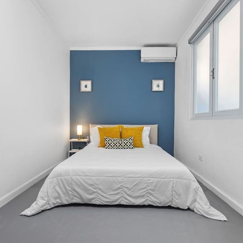 Unwind in Style: Cozy bedroom featuring a plush king-sized bed and elegant, modern decor, designed for ultimate relaxation after a day of exploration.