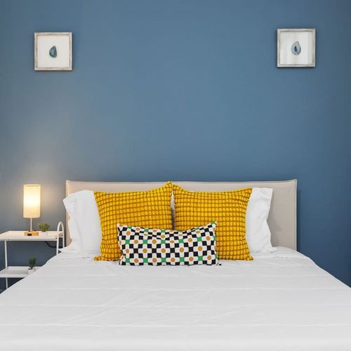 "Sun-Kissed Slumbers: Wake up refreshed in this bright and airy bedroom, boasting a contemporary design and an abundance of natural light, ensuring a delightful start to your day.