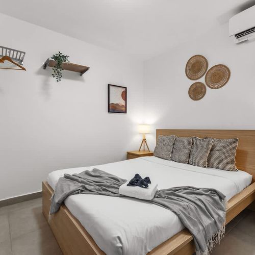 Stay cool and entertained in this comfortable bedroom, complete with air conditioning and a flat-screen TV for your convenience.
