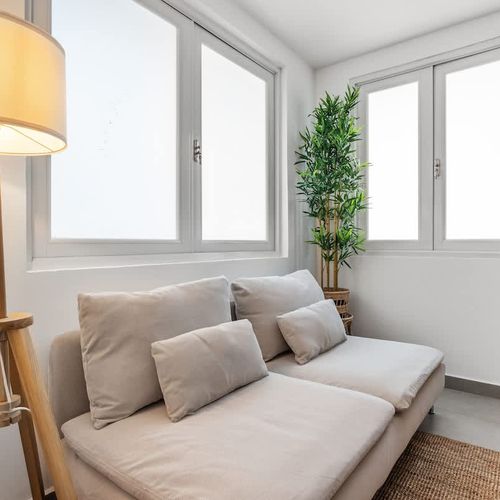 Enjoy a peaceful retreat in this cozy area, with a comfortable sofa for ultimate relaxation.