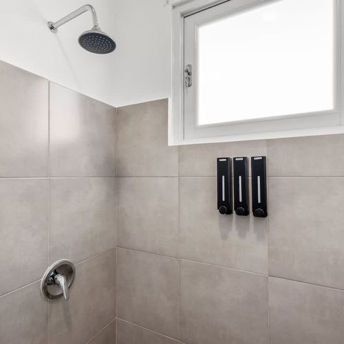 Indulge in a refreshing shower in this elegant bathroom.