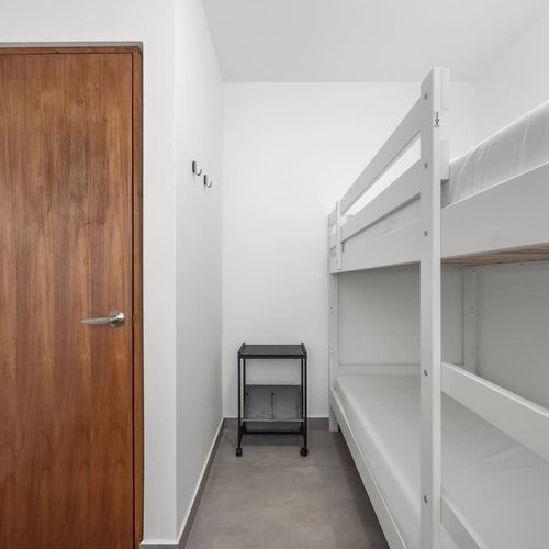 Designed for families or groups, this cozy bedroom includes a spacious bunk bed for ultimate comfort.