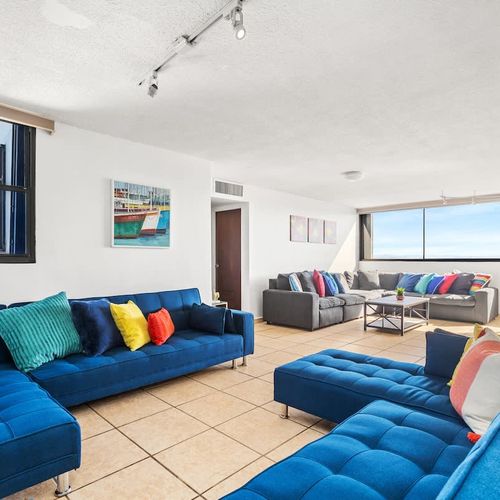 Relax on a stylish sofa in this bright living area.