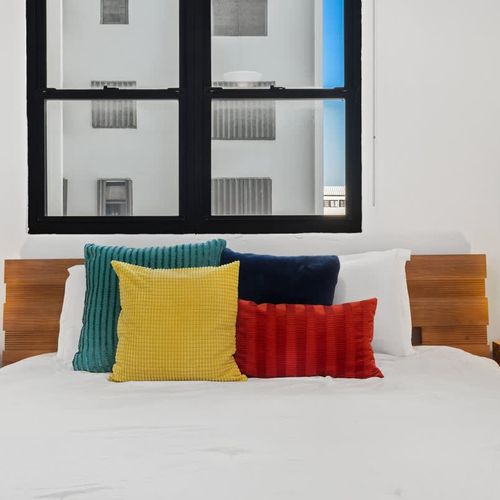 Calming bedroom offering picturesque views and comfort.