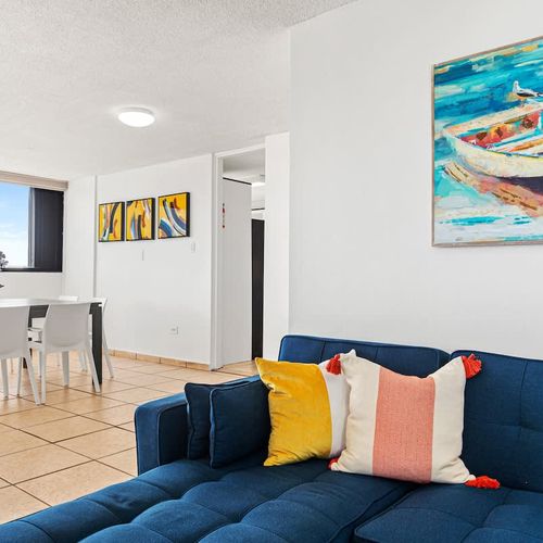 Inviting lounge area with natural light and comfy seating.