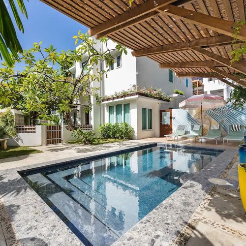 Experience outdoor bliss with a refreshing dip in your exclusive swimming pool.