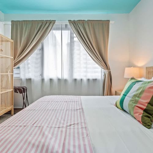 Tastefully decorated bedroom with soft lighting for a serene atmosphere.