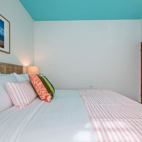 Adorned with charming decor and soft lighting for a restful night.