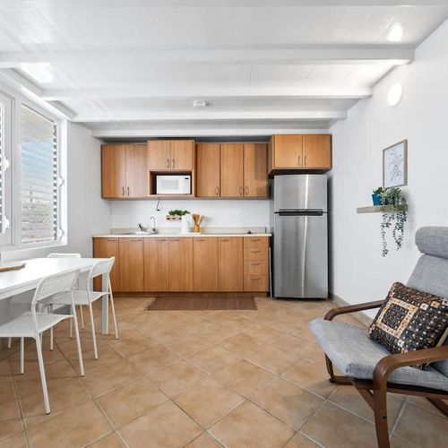 A fully equipped kitchen with a counter for food prep.