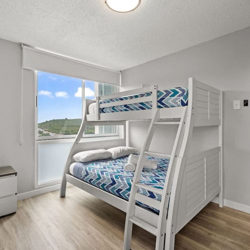 Adventure awaits for the younger guests (or young at heart)! This fun and functional room features sturdy bunk beds, providing a comfortable and exciting sleeping arrangement for kids or extra guests.