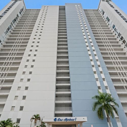 Modern architecture meets stunning location! This unique aerial view showcases the contemporary design of our building, highlighting its sleek lines and impressive scale within its beautiful surroundings.