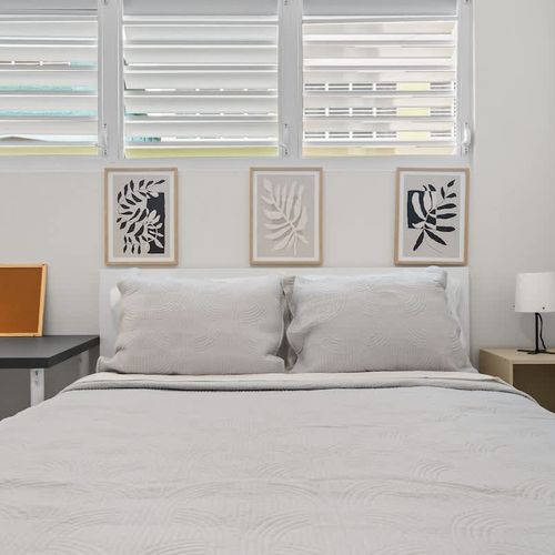 Spotless linens for a five-star rest. Thoughtful decor and lighting.