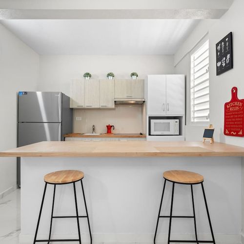 Sleek wood counter and modern appliances. Cook like home!