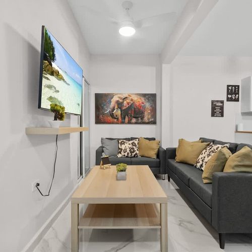 Cozy living room with large TV for movie nights!