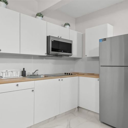 Fully stocked kitchen with new appliances. Cook like home!