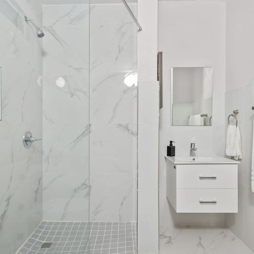 Enjoy a refreshing shower in this clean, stylish space.