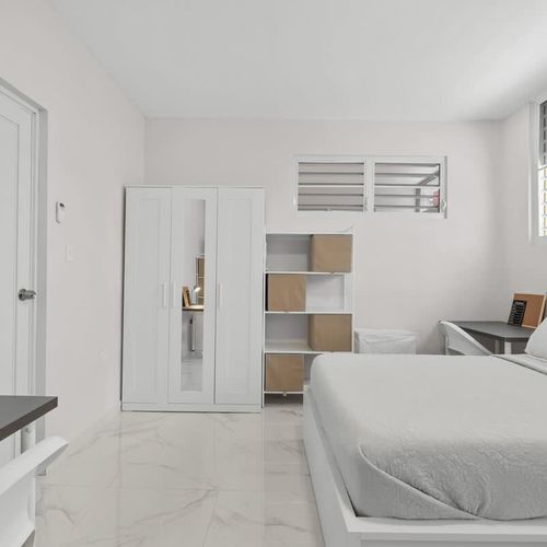 Sink into this inviting, well-lit, and super comfortable bed.