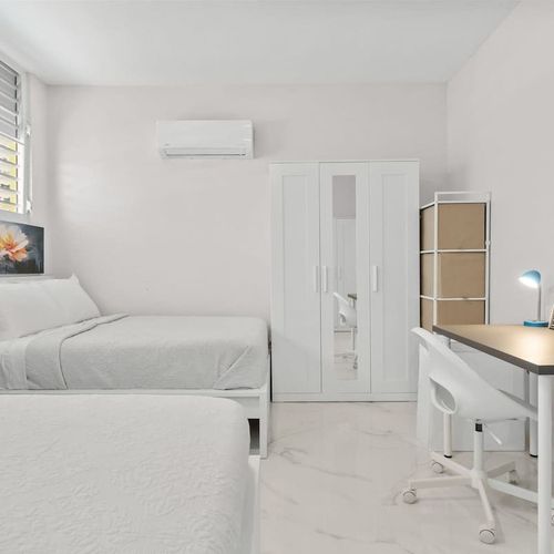 Sink into this inviting, well-lit, and super comfortable bed.