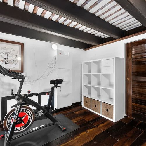 Static Bike and Smart storage: Clean, accessible shelves for your belongings.