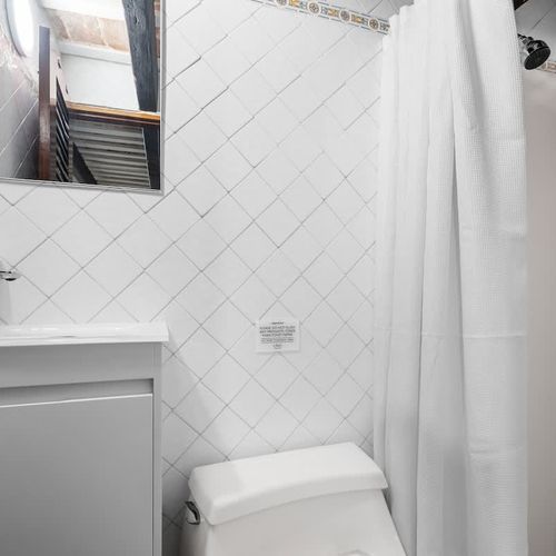 Pristine bath: Bright, clean bathroom for refreshing your senses.