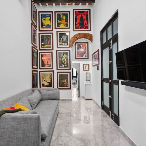 Collector's corner: Eclectic shelving with books, plants, and art.