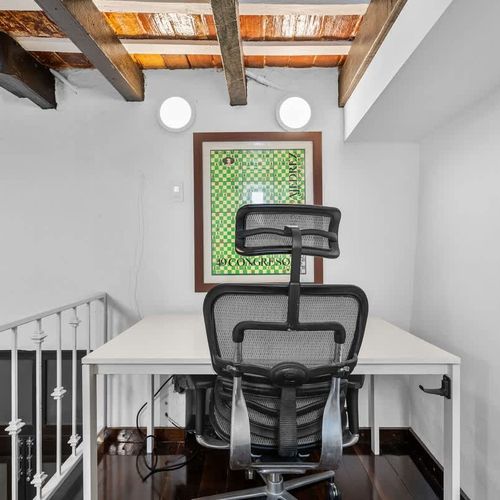 Productive space: Simple desk setup in a bright, quiet corner.