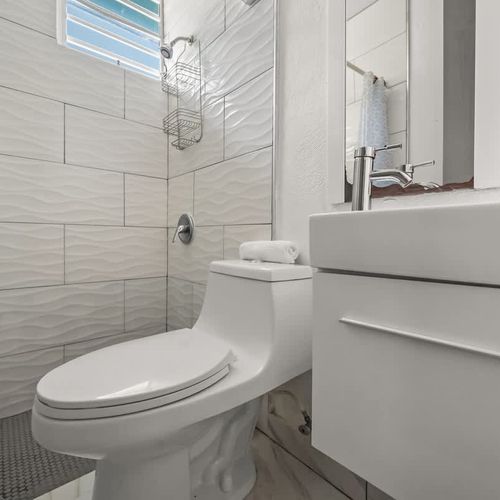 Modern fixtures, sparkling clean vanity space.