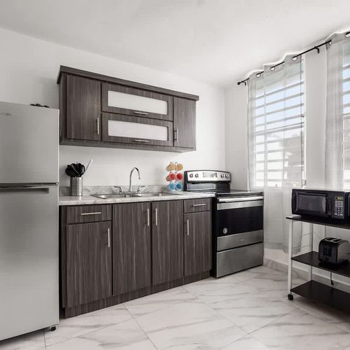 Chef's kitchen with stainless steel appliances.