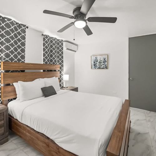 Comfortable queen bed in a peaceful setting.