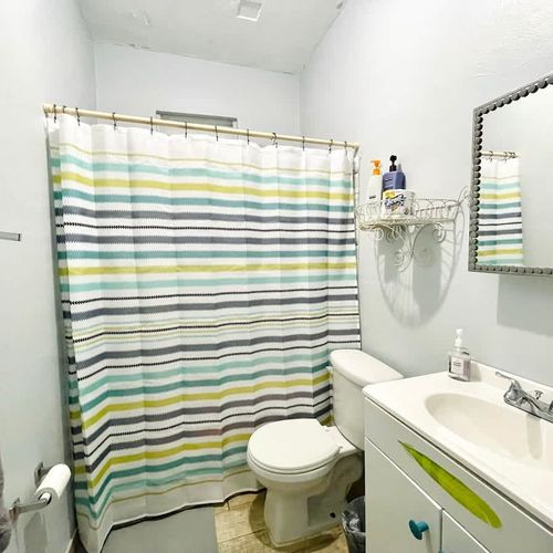 Refresh and rejuvenate! Our clean and modern bathroom features a spacious shower, ensuring a comfortable and invigorating start or end to your day.